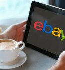 Man holding tablet computer in cafe. Close up